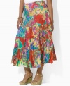 Airy, crinkled cotton lends casual elegance to Lauren by Ralph Lauren's flowing plus size maxi skirt, constructed in a tiered silhouette with a vibrant floral print for exotic glamour.