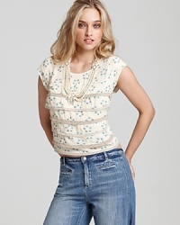Tiers of ruffles through the bodice of this printed Free People top create a feminine look for the transitional season. Layered over a romantic dress or worn solo--the cropped silhouette is a chic addition to your capsule collection. Tiers of ruffles through the bodice of this printed Free People top create a feminine look for the transitional season. Layered over a romantic dress or worn solo--the cropped silhouette is a chic addition to your capsule collection.
