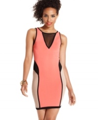 Baby Phat brings sexy back with a body-hugging colorblock dress that sports a collection of sheer mesh insets! Baby Phat brings sexy back with a body-hugging colorblock dress that sports a collection of sheer mesh insets!