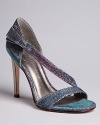 Iridescent metallic fabric lends this perfect pair of evening sandals a magical touch for your next soiree; by IVANKA TRUMP.