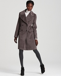Evoke menswear chic in this tailored Calvin Klein Premium double-breasted coat, flaunting a classic notch collar and a quartet of dapper buttons. Evoke menswear chic in this tailored Calvin Klein Premium double-breasted coat, flaunting a classic notch collar and a quartet of dapper buttons.