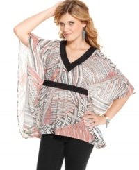 Jessica Simpson pairs a bold abstract print with poncho design on a top that adds optimal style to your day look! Jessica Simpson pairs a bold abstract print with poncho design on a top that adds optimal style to your day look!