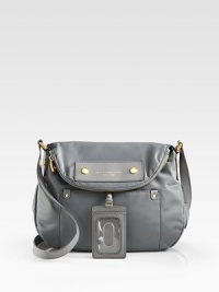 Carry daily essentials in this durable nylon silhouette with gleaming hardware and a signature logo patch. Adjustable shoulder strap, 18-21 dropMagnetic flap closure with top zipOne outside open pocketOne inside zip pocketTwo inside open pocketsFully lined12W X 11H X 3½DImported Carry daily essentials in this durable nylon silhouette with gleaming hardware and a signature logo patch. Adjustable shoulder strap, 18-21 dropMagnetic flap closure with top zipOne outside open pocketOne inside zip pocketTwo inside open pocketsFully lined12W X 11H X 3½DImported