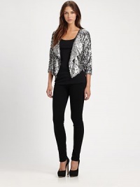 Embrace the wow factor in this cropped sequin blazer with dolman sleeves and a contour hem. Oversized shawl collarThree-quarter dolman sleevesContoured cropped back hemAbout 23 from shoulder to hemViscoseDry cleanImportedModel shown is 5'9 (176cm) wearing US size Small.