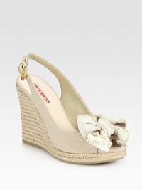Canvas and espadrille wedge design with bow detail and an adjustable slingback. Espadrille wedge, 4 (100mm)Espadrille platform, ½ (15mm)Compares to a 3½ heel (90mm)Canvas upperLeather liningRubber solePadded insoleImportedOUR FIT MODEL RECOMMENDS ordering true size. Canvas and espadrille wedge design with bow detail and an adjustable slingback. Espadrille wedge, 4 (100mm)Espadrille platform, ½ (15mm)Compares to a 3½ heel (90mm)Canvas upperLeather liningRubber solePadded insoleImportedOUR FIT MODEL RECOMMENDS ordering true size.