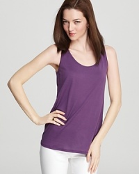 Add a pop of color to your working wardrobe with this slouchy Eileen Fisher tank. A bold grape hue adorns a longer silhouette for a peppy version of the closet staple. Add a pop of color to your working wardrobe with this slouchy Eileen Fisher tank. A bold grape hue adorns a longer silhouette for a peppy version of the closet staple.