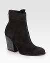 Downtown cool style made of ultra-soft suede, finished with exposed zippers and a towering stacked heel. Stacked heel, 4 (100mm)Suede upperFront and back zipLeather lining and solePadded insoleImported