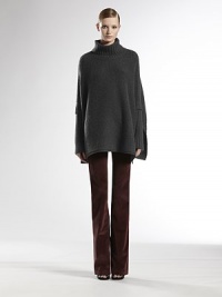 Plush, fine-knit Italian wool in a poncho silhouette.Rib-knit turtleneckPoncho sleeves with side drapeDual rib-knit sleeves with long cuffsSignature leather GG detail at hemWoolDry cleanMade in ItalyModel shown is 5'11 (180cm) wearing US size Small. Plush, fine-knit Italian wool in a poncho silhouette.Rib-knit turtleneckPoncho sleeves with side drapeDual rib-knit sleeves with long cuffsSignature leather GG detail at hemWoolDry cleanMade in ItalyModel shown is 5'11 (180cm) wearing US size Small.