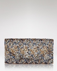 Covered in a luxe layer of sequins, this Cornelia Guest clutch steps in when a standard soiree bag just won't do. The snap closure opens to reveal four credit card slots and a lined interior.