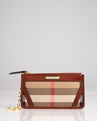 This Burberry coin case keeps your littlest essentials (and spare change) in check, crafted of a mix of canvas and leather in the brand's signature motif. This Burberry coin case keeps your littlest essentials (and spare change) in check, crafted of a mix of canvas and leather in the brand's signature motif.