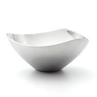 Fluid, unified shape with three soft corners. Refreshingly innovative, each Nambé piece is an achievement of precision, balance and function. Individual artists use Nambé, a superior metal alloy that retains heat and cold for ideal serving temperatures. Made in USA. Fluid, unified shape with three soft corners. Refreshingly innovative, each Nambé piece is an achievement of precision, balance and function. Individual artists use Nambé, a superior metal alloy that retains heat and cold for ideal serving temperatures. Made in USA.