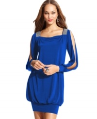 Bombshell dress alert! This sultry number from Baby Phat will get the party started with its plunging V-neck at the back and flirty split sleeves. Bombshell dress alert! This sultry number from Baby Phat will get the party started with its plunging V-neck at the back and flirty split sleeves.