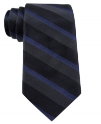With a subtle blend of colors, this Calvin Klein striped skinny tie makes a solid statement. With a subtle blend of colors, this Calvin Klein striped skinny tie makes a solid statement.
