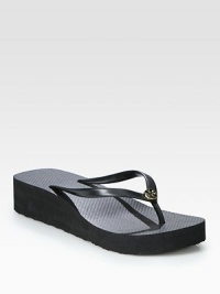 Topped with a signature designer emblem, a traditional thong rests upon a comfortable foam platform. Foam platform, 1½ (40mm)PVC upperRubber lining and solePadded insoleImportedOUR FIT MODEL RECOMMENDS ordering true whole size; ½ sizes should order the next whole size Topped with a signature designer emblem, a traditional thong rests upon a comfortable foam platform. Foam platform, 1½ (40mm)PVC upperRubber lining and solePadded insoleImportedOUR FIT MODEL RECOMMENDS ordering true whole size; ½ sizes should order the next whole size