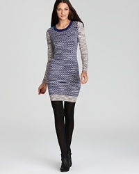 An abstract zig zag print ups the cool factor with this soft knit French Connection sweater dress. An abstract zig zag print ups the cool factor with this soft knit French Connection sweater dress.