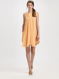 An airy silk frock with a sporty zipper and draped cascade front.Round necklineSleevelessHidden quarter front zipperPleated draped center front panelSide seam pocketsContour hemAbout 17 from natural waistSilkDry cleanImported An airy silk frock with a sporty zipper and draped cascade front.Round necklineSleevelessHidden quarter front zipperPleated draped center front panelSide seam pocketsContour hemAbout 17 from natural waistSilkDry cleanImported