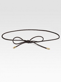 This slender, braided leather cord is tipped in elegant goldtone caps, and can be knotted in a variety of stylish ways.About ¼ in diameterGoldtone metal tipsLeatherImported of Swiss fabric