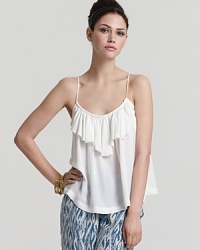 A silk Joie tank featuring a single feminine ruffle at the neckline defines elegance, the perfect piece to pair with everything from bold printed pants to a sleek pencil skirt. A silk Joie tank featuring a single feminine ruffle at the neckline defines elegance, the perfect piece to pair with everything from bold printed pants to a sleek pencil skirt.