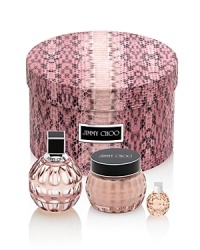 Reveal the glamorous seductress in you with this elegant Jimmy Choo gift set that includes a selection of Jimmy Choo treasures: a 3.3 fl. oz. Eau de Parfum, 5 fl. oz. Perfumed Body Cream, and a 0.15 Eau de Parfum miniature. Reveal the glamorous seductress in you with this elegant Jimmy Choo gift set that includes a selection of Jimmy Choo treasures: a 3.3 fl. oz. Eau de Parfum, 5 fl. oz. Perfumed Body Cream, and a 0.15 Eau de Parfum miniature.