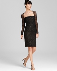 In sequined, metallic lace, David Meister's square neck creation lends an alluring look that's perfectly paired with vampy red lips. In sequined, metallic lace, David Meister's square neck creation lends an alluring look that's perfectly paired with vampy red lips.