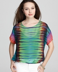 A rainbow of color splashes the relaxed silhouette of this VINCE CAMUTO sheer blouse, the perfect partner to slim jeans. A rainbow of color splashes the relaxed silhouette of this VINCE CAMUTO sheer blouse, the perfect partner to slim jeans.