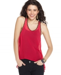 Flaunt your tank love this season with a chiffon variation that boasts fun, braided trims and a trend-forward asymmetrical design! From Lily White. Flaunt your tank love this season with a chiffon variation that boasts fun, braided trims and a trend-forward asymmetrical design! From Lily White.
