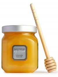 Twirl this thick, honey-rich emulsion into the bath with the included wooden dipper, and experience a new twist on luxury. Rich foaming bubbles and a light fragrance transform the bath into a decadent honey moisture treat. Contains vitamins A and E, plus natural ingredients such as sage, rosemary, lavender, ivy and papaya extracts that firm, lift, purify and tone the skin. Fragranced with a delicious combination of caramel, petals of peony and vanilla notes for a creme caramel essence. 12 oz. Twirl this thick, honey-rich emulsion into the bath with the included wooden dipper, and experience a new twist on luxury. Rich foaming bubbles and a light fragrance transform the bath into a decadent honey moisture treat. Contains vitamins A and E, plus natural ingredients such as sage, rosemary, lavender, ivy and papaya extracts that firm, lift, purify and tone the skin. Fragranced with a delicious combination of caramel, petals of peony and vanilla notes for a creme caramel essence. 12 oz.
