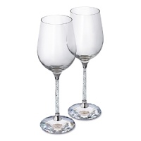 Make your dining experience a memorable one with this set of two festive white wine glasses. Their stems are filled with clear crystal chatons for a sparkling effect and the base is made of a large faceted clear crystal.