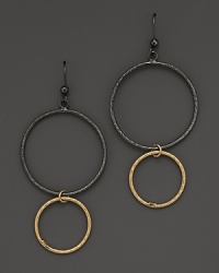Striking, elegant hoops of black and yellow gold. By Lana.