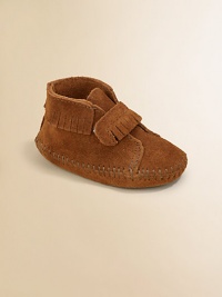 Classic moccasin stitching, fringe and an easy on/easy off grip-tape strap make this plush suede pair a must-have for baby.Grip-tape strap closureSuede upperSuede solePadded insoleImported Classic moccasin stitching, fringe and an easy on/easy off grip-tape strap make this plush suede pair a must-have for baby.Grip-tape strap closureSuede upperSuede solePadded insoleImported
