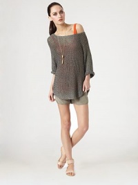 Intricately woven boatneck with a contoured hi-low hem, sheen finish and long dolman sleeves. BoatneckDropped shouldersLong dolman sleevesContoured hi-low hem hits below the hips82% viscose/18% polyesterDry cleanImported of Italian fabricModel shown is 5'10 (177cm) wearing US size Small. Intricately woven boatneck with a contoured hi-low hem, sheen finish and long dolman sleeves. BoatneckDropped shouldersLong dolman sleevesContoured hi-low hem hits below the hips82% viscose/18% polyesterDry cleanImported of Italian fabricModel shown is 5'10 (177cm) wearing US size Small.