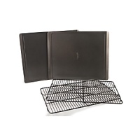 This professional quality Calphalon cookie sheet and cooling rack set offers even heating and cooling across the entire surface for uniform baking of your entire batch. The nonstick surface guarantees that even thin, delicate cookies will slide off the sheet easily. Two cooling racks allow you bake batch after batch, quickly and efficiently. This professional quality Calphalon cookie sheet and cooling rack set offers even heating and cooling across the entire surface for uniform baking of your entire batch. The nonstick surface guarantees that even thin, delicate cookies will slide off the sheet easily. Two cooling racks allow you bake batch after batch, quickly and efficiently.