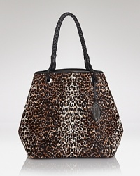 A slouchy, spacious tote from Elie Tahari easily manages chic functionality, crafted from spot-splashed cow fur and perfectly sized for the to on-duty essentials. A slouchy, spacious tote from Elie Tahari easily manages chic functionality, crafted from spot-splashed cow fur and perfectly sized for the to on-duty essentials.