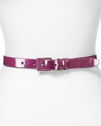 Cole Haan cinches your look this season with a simply styled leather and enamel belt, which closes with an adjustable square buckle. Cole Haan cinches your look this season with a simply styled leather and enamel belt, which closes with an adjustable square buckle.