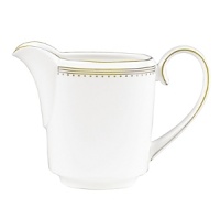 Rings of gold adorn fine white bone china with the lustrous shine of a wedding band. White bone china features two different border trims of gold, a wide corded border of textured grosgrain ribbon on some pieces, a narrow edge on others. Rings of gold adorn fine white bone china with the lustrous shine of a wedding band. White bone china features two different border trims of gold, a wide corded border of textured grosgrain ribbon on some pieces, a narrow edge on others.