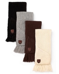 The all-essential knit scarf from UGG® Australia with classic fringe detailing and pockets for added warmth. The all-essential knit scarf from UGG® Australia with classic fringe detailing and pockets for added warmth.