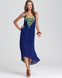 Trend-right neon embroidery takes center stage on this brilliant blue Twelfth Street by Cynthia Vincent maxi dress, styled with a scoop smocked neckline for the most subtle touch of allure. Trend-right neon embroidery takes center stage on this brilliant blue Twelfth Street by Cynthia Vincent maxi dress, styled with a scoop smocked neckline for the most subtle touch of allure.