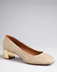Tory Burch lightens up the season's square toe pumps in woven fabric accented with shining metal heels, perfect with warm-weather work attire. Tory Burch lightens up the season's square toe pumps in woven fabric accented with shining metal heels, perfect with warm-weather work attire.