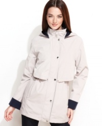 A blustery day calls for Nautica's lightweight hooded anorak. Contrasting colored cuffs and lining (plus a layered-look front) give this classic unique new look. A blustery day calls for Nautica's lightweight hooded anorak. Contrasting colored cuffs and lining (plus a layered-look front) give this classic unique new look.