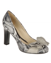 Sugar and spice. An oversized bow tops off the alluring round-toe silhouette of the comfortable Peg pumps by Naturalizer. Sugar and spice. An oversized bow tops off the alluring round-toe silhouette of the comfortable Peg pumps by Naturalizer.