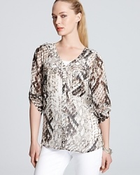 Enliven your everyday style with an exotic shot of snake print. Tame the Shiloh770 blouse with white denim and sleek accents for a safari-chic look. Enliven your everyday style with an exotic shot of snake print. Tame the Shiloh770 blouse with white denim and sleek accents for a safari-chic look.