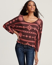 Accentuated by a bold tribal print, this Vintage Havana tee is the perfect companion piece to faded jeans and earthy accessories. Accentuated by a bold tribal print, this Vintage Havana tee is the perfect companion piece to faded jeans and earthy accessories.