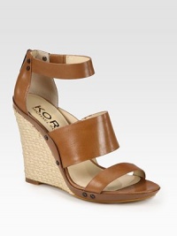 Substantial espadrille wedge accompanied by studded leather straps and an exposed back zipper. Braided hemp wedge, 4 (100mm)Leather upperLeather lining and solePadded insoleImported Substantial espadrille wedge accompanied by studded leather straps and an exposed back zipper. Braided hemp wedge, 4 (100mm)Leather upperLeather lining and solePadded insoleImported