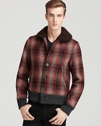 The rugged shearling collar augments the traditional plaid design for a traditional yet contemporary jacket full of heritage appeal. From Burberry Brit. The rugged shearling collar augments the traditional plaid design for a traditional yet contemporary jacket full of heritage appeal. From Burberry Brit.