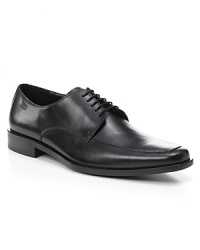 Square toe dress shoe with lace up front with top stitching detailing on front, rubber heel, slightly stacked. Square toe dress shoe with lace up front with top stitching detailing on front, rubber heel, slightly stacked.