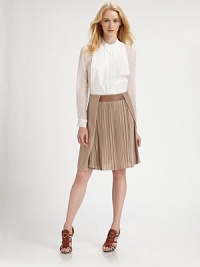 Crisply-tailored cotton poplin finished with plisse pleats, a flared hem and silk chiffon sleeves.Band collarPleated button-down placketSilk chiffon sleeves and side insetsInverted back pleatAbout 38 from shoulder to hemBody: cotton; sleeves: silkDry cleanMade in USAModel shown is 5'10½ (179cm) wearing US size 4. Crisply-tailored cotton poplin finished with plisse pleats, a flared hem and silk chiffon sleeves.Band collarPleated button-down placketSilk chiffon sleeves and side insetsInverted back pleatAbout 38 from shoulder to hemBody: cotton; sleeves: silkDry cleanMade in USAModel shown is 5'10½ (179cm) wearing US size 4.