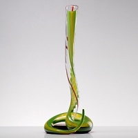 In celebration of Claus Riedel, the creator of grape varietal-specific wine glasses, and 50 years of our factory in Kufstein, Austria, Maximilian Riedel created this very limited-production, signed decanter - the most exotic, collectible decanter Riedel has ever made. Mouth-blown in the Venetian style of glass making, it's accented with bold green and yellow stripes and comes packed in a custom-made wooden crate constructed from wood from the floor of the original factory. In celebration of Claus Riedel, the creator of grape varietal-specific wine glasses, and 50 years of our factory in Kufstein, Austria, Maximilian Riedel created this very limited-production, signed decanter - the most exotic, collectible decanter Riedel has ever made. Mouth-blown in the Venetian style of glass making, it's accented with bold green and yellow stripes and comes packed in a custom-made wooden crate constructed from wood from the floor of the original factory.