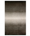 Crafted with an eye-catching ombre effect -- in which colors blend gradually into one another -- this hand-tufted area rug from Liora Manne has an organic flow that adds visual interest and irresistible allure to any floor.