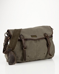 Authentic leather accents make this versatile canvas messenger bag a suitable carryall for work or weekend. Authentic leather accents make this versatile canvas messenger bag a suitable carryall for work or weekend.