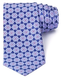 A nature-inspired pattern of snowflake-like flowers adorns this handsome tie from Valentino, a refined design in pure Italian silk. A nature-inspired pattern of snowflake-like flowers adorns this handsome tie from Valentino, a refined design in pure Italian silk.